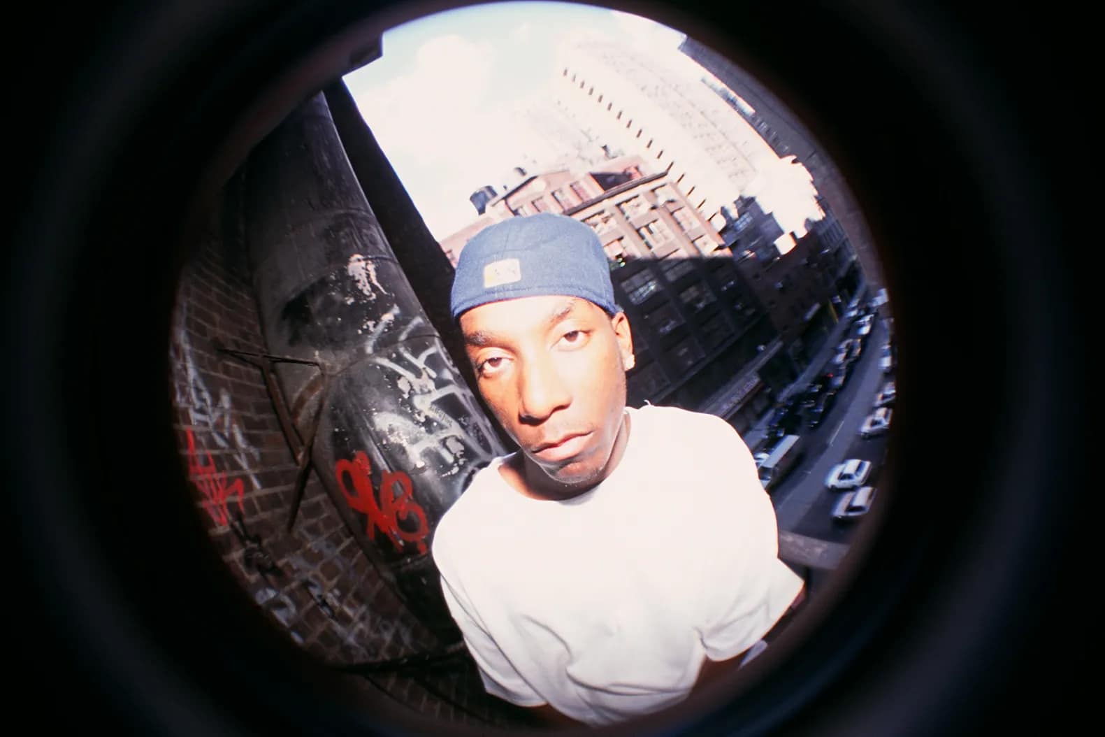 Rapper & New York Native Big L being photographed in fish eye effect, most likely for music promo